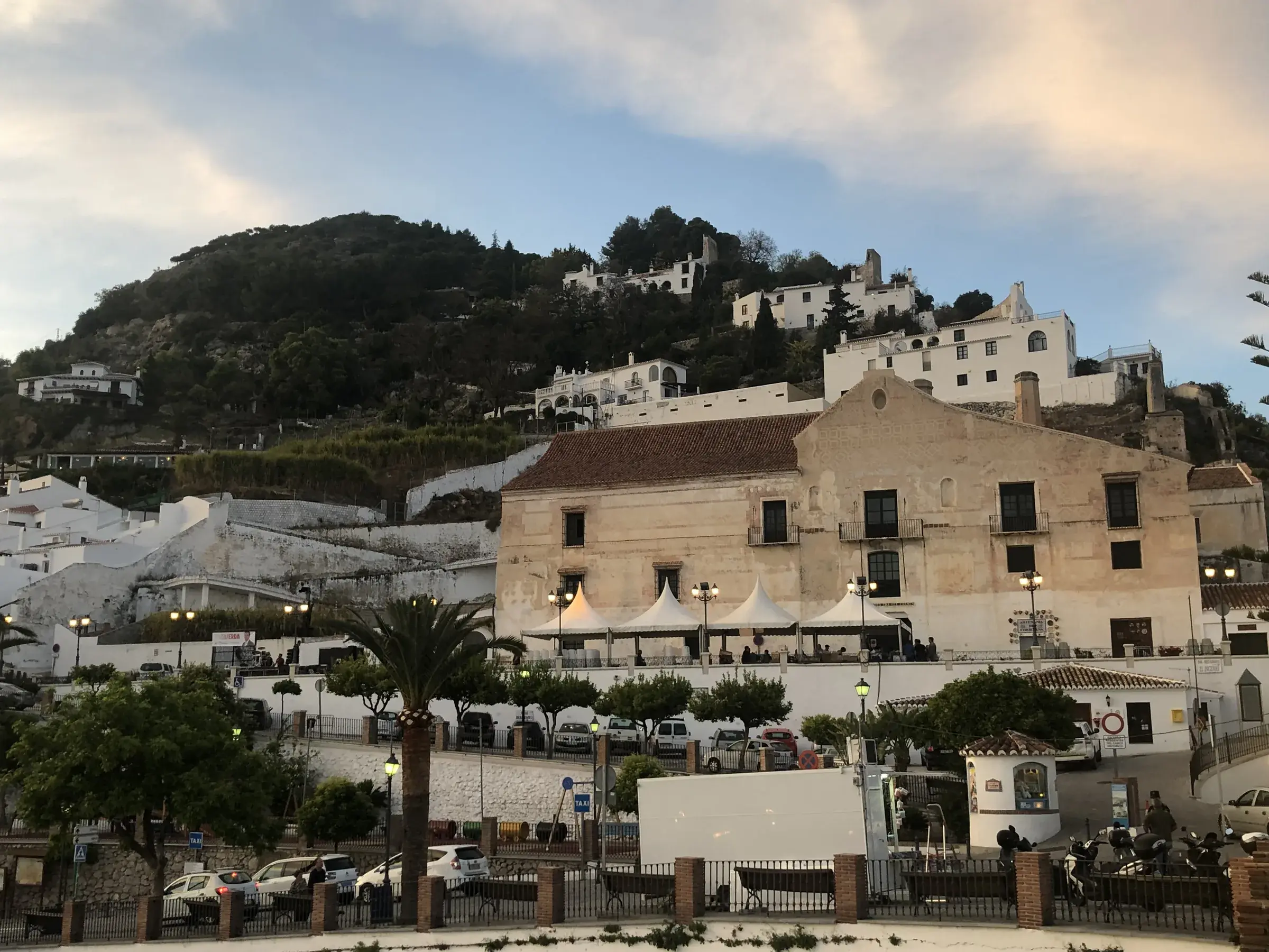 The plaza in front of Casa del Apero, Frigiliana, lit by a warm summer sunset.