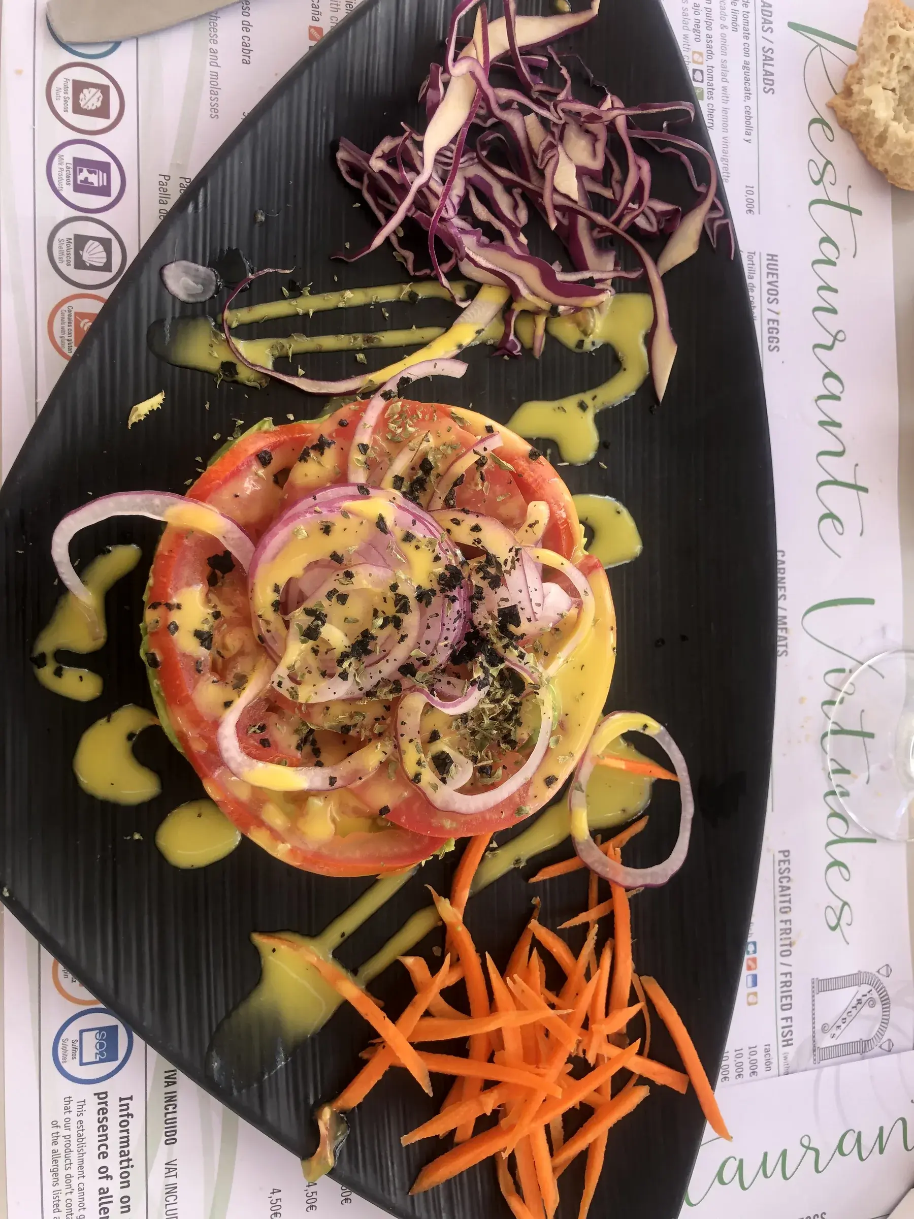 Andalusian tomato and red onion salad with olive oil dressing at a Frigiliana restaurant.